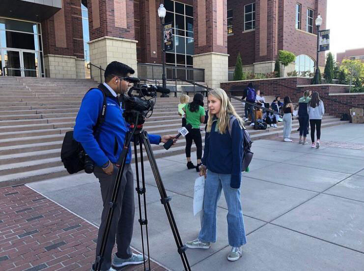 Caroline Sandberg being interviewed during the climate march in Nevada